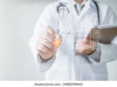 Medicine doctor use tablet to review patient medical records on virtual screens for digital healthcare. Review medical reports carefully and diagnose illnesses for an effective treatment plan. - Powered by Shutterstock