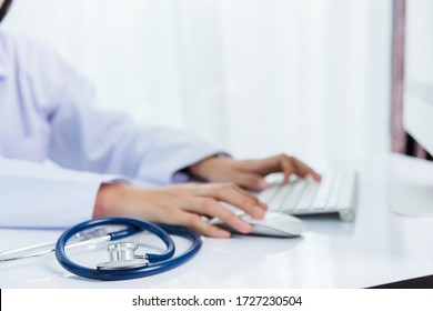 Medicine doctor's working on desk. Closeup of Stethoscope. Hand of woman physician type keyboard to order medicine for patients on table front PC computer at hospital office, Healthcare medic concept