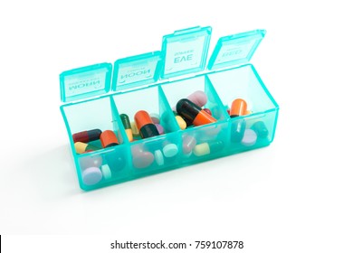 Medicine Dose Box Isolated On White Background - Daily Dosage Of Medication In Blue Pill Dispenser