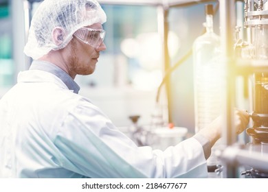 Medicine Factory Scientist Worker With Cannabis CBD Oil Extraction Machine. Hemp Oil Extraction Thin Film Distillation Laboratory Plants Process.