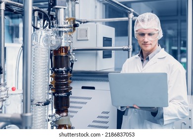 Medicine Factory Scientist Worker With Cannabis CBD Oil Extraction Machine. Hemp Oil Extraction Thin Film Distillation Laboratory Plants Process.