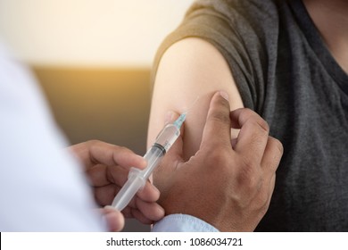 Medicine and health care concept Doctor giving patient vaccine insulin or vaccination