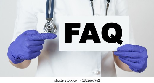 Medicine And Health Concept. The Doctor Points His Finger At A Sign That Says - FAQ. Frequently Asked Questions