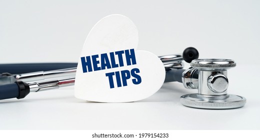 Medicine And Health Concept. On A White Background Lies A Stethoscope And A Heart Plate With The Inscription - Health Tips