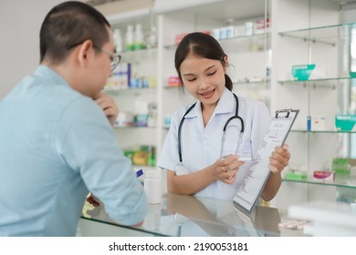 Medicine And Health Concept, Pharmacist Explain Prescription And Side Effect Of Medicine To Client.