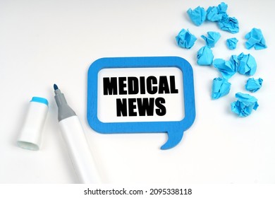 Medicine And Health. On A White Surface Are Crumpled Blue Paper, A Marker And A Sign Inside Which Is Written - MEDICAL NEWS