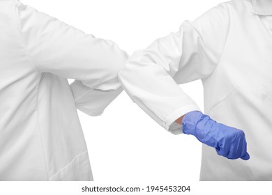 Medicine, Health Protection And Healthcare Concept - Close Up Of Doctors Make Elbow Bump Greeting Gesture Over White Background