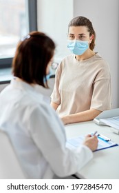 Medicine, Healthcare And Pandemic Concept - Female Doctor In Medical Protective Mask Or Nurse With Clipboard And Patient At Hospital