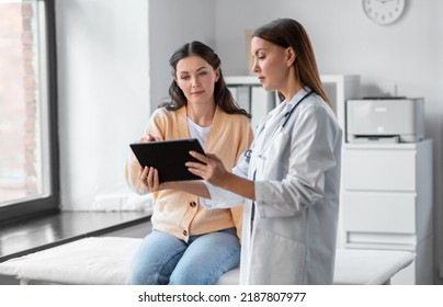 medicine, healthcare and people concept - female doctor with tablet pc computer talking to woman patient at hospital - Shutterstock ID 2187807977