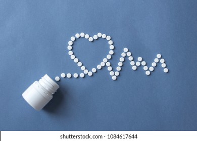 Medicine, Healthcare And Pharmacy Concept -  Pills And  Of Drugs In Shape Of The Heart And Heart Rhythms. 