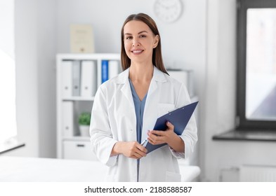 medicine, healthcare and profession concept - smiling female doctor with clipboard at hospital - Powered by Shutterstock