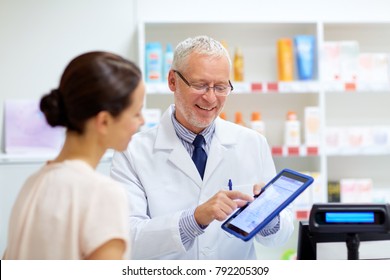 medicine, healthcare and technology concept - senior apothecary and female customer with digital prescription on tablet pc computer screen at pharmacy