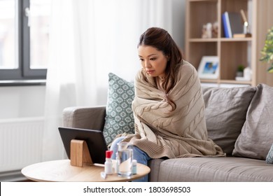 Medicine, Healthcare And Technology Concept - Sick Young Asian Woman Having Video Call Or Online Consultation On Tablet Pc Computer At Home