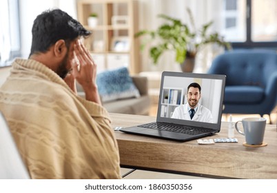 Medicine, Healthcare And Technology Concept - Sick Young Man Having Video Call Or Online Medical Consultation With Doctor On Laptop Computer At Home