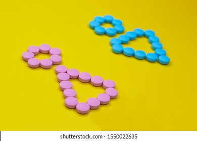 Medicine For Men And Women. Hormone Therapy And Oral Contraception. Gender Symbols From Pills.