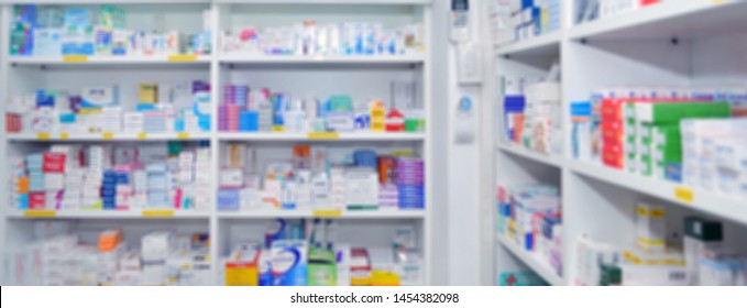 Medicine on shelves in Pharmacy interior with blurred background
