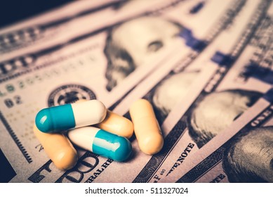 Medicine Pills Or Capsules With Money, Dollar. Medical Or Pharmacy Prescription For Health. Business, Finance Concept. Cost Of The Healthy Life. Bottle Of Drug Or Vitamin For Currency. 