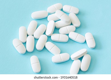 lot of medicine pills on blue background