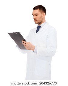 medicine, profession, and healthcare concept - serious male doctor with clipboard writing prescription over white background