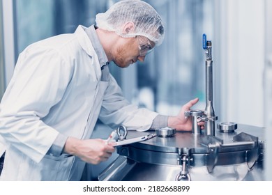 medicine science factory staff worker products sterilize process in autoclave tank in lab - Shutterstock ID 2182668899