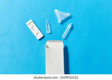 Medicine, Self Testing And Pandemic Concept - Coronavirus Saliva Test Kit On Blue Background