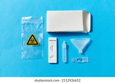 Medicine, Self Testing And Pandemic Concept - Coronavirus Saliva Test Kit On Blue Background