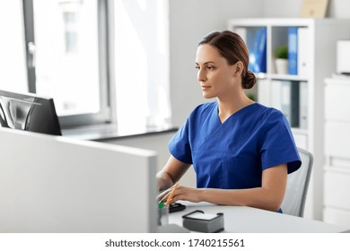 Medicine, Technology And Healthcare Concept - Female Doctor Or Nurse With Computer Working At Hospital