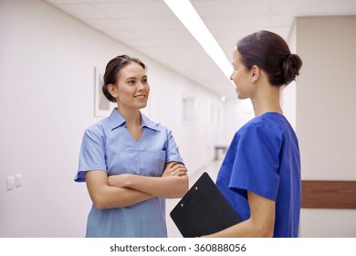 Medics, Nurses Or Doctors Talking At Hospital