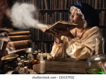 Medieval Alchemist Blowing Dust Off The Old Books In Her Laboratory