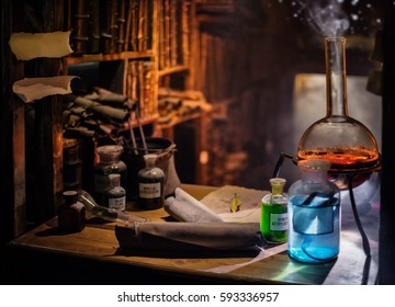 Medieval alchemist laboratory with various kind of flasks and old books in Prague, czech republic
