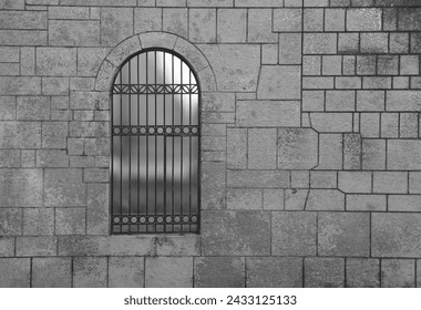 Medieval Arch Stone Blocks Castle Gate with Metal Lattice. black background. Stone wall with door protected by iron bars. wrought-iron gate at a decorative entrance to stone house. - Powered by Shutterstock
