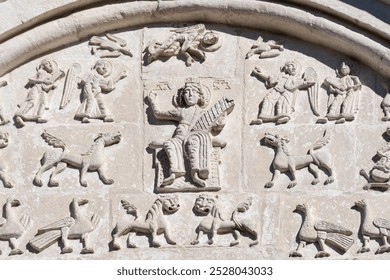 Medieval bas-relief sculptures, depicting King David surrounded by angels and animals, on the facade of St. Demetrius Cathedral, Vladimir, Russian Federation - Powered by Shutterstock