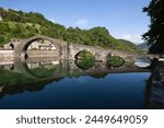 Medieval bridge of Ponte della Maddalena on the River Serchio, Borgo a Mozzano, near Lucca, Garfagnana, Tuscany, Italy, Europe