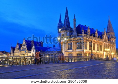 Medieval buildings and the old Post Office as seen from St Michael's bridge at evening, Ghent, Belgium