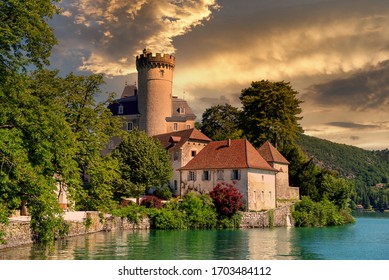 a medieval castle on Annecy lake in Alpes mountains, France