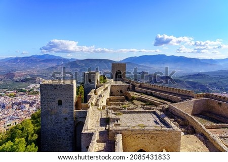 Medieval castle on top of a mountain with the city of Jaen below. Santa Catalina.