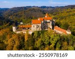 Medieval castle of Pernstein on a hill in the forest. South Moravian region. Czech Republic