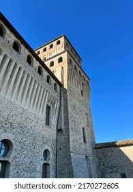 Medieval Castle Of Torrechiara In Parma Defensive Walls And Drawbridge. High Quality Photo