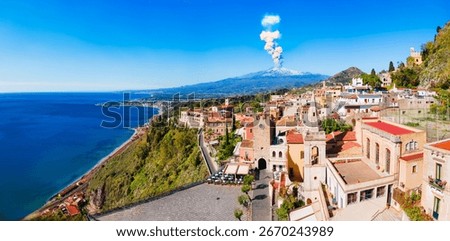 Medieval Clock Tower Gate and Chiesa di San Giuseppe or St. Joseph Church aerial panoramic view at the Piazza IX Aprile main square in Taormina city, Sicily island, Italy