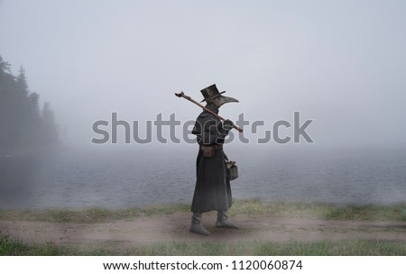 Medieval era. The plague doctor walks along the road near the misty lake Stockfoto © 