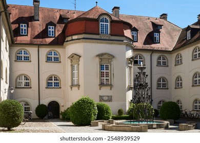 Medieval European Architecture: Maxhof House with Central Courtyard Fountain in Lindau, Germany. Picturesque Summer Scene Showcasing Historic Bavarian Building and Traditional German Craftsmanship. - Powered by Shutterstock