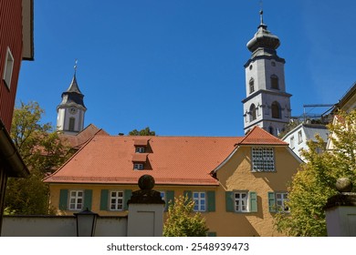 Medieval European Architecture: Picturesque Rooftops and Historic Town Hall Against Summer Sky in Lindau, Germany. Charming Cityscape Showcasing Gothic and Renaissance Architectural Heritage. - Powered by Shutterstock