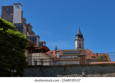 Medieval European Architecture: Picturesque Rooftops and Historic Town Hall Against Summer Sky in Lindau, Germany. Charming Cityscape Showcasing Gothic and Renaissance Architectural Heritage. - Powered by Shutterstock