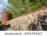 medieval fortifications with a brick tower and a stone wall in Prenzlau, Germany