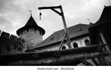 Medieval Gallows On The Background Of A Medieval Castle