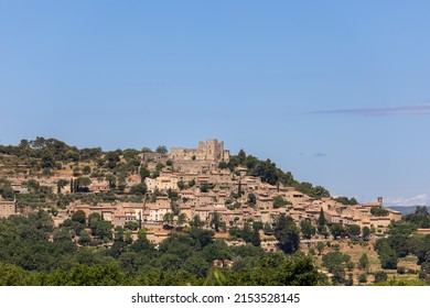 Medieval historic Lacoste village stands on hilltop of Little Luberon massif with ruins Marquis de Sade castle. Vaucluse, Provence, France