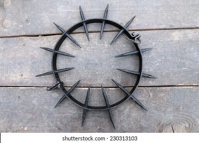 Medieval instrument of torture Spiked Punishment Collar (iron collar, spanish collar) on wooden background