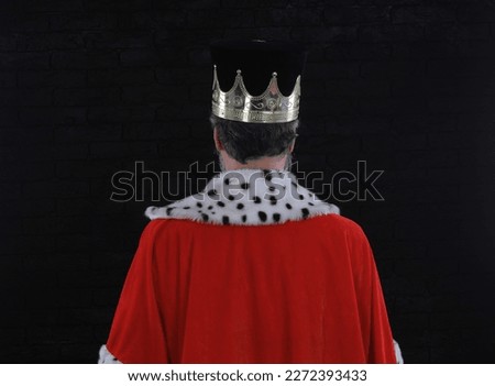 medieval king back on black background