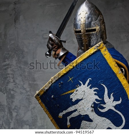 Medieval knight in attack position.