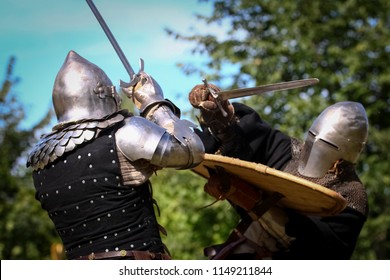 Medieval knight fighting another kight with a sword